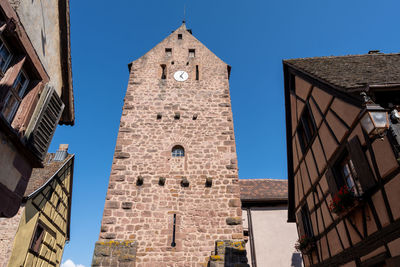 Riquewihr historical town timbered houses along the narrow cobble stoned street. taken in riquewihr