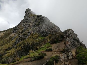 Rock formations on mountain against sky