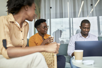 Young couple sitting on table