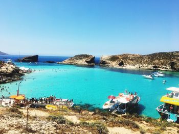 Panoramic view of sea against clear blue sky