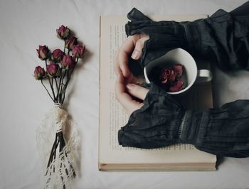 Close-up of hand on table at home