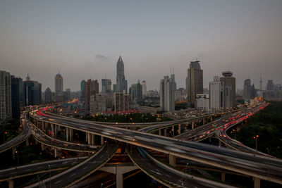 High angle view of light trails on road in city