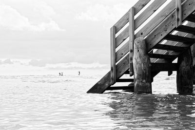 Pier over sea against sky