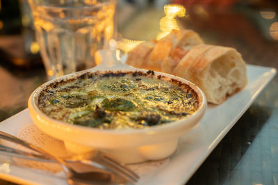 Close-up of served food in plate on table