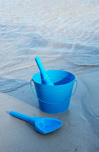 High angle view of bucket on beach