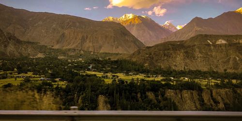 Scenic view of landscape and mountains against sky