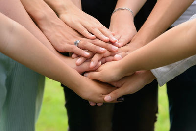 Midsection of woman holding hands