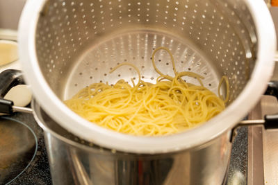 High angle view of noodles in cooking pan