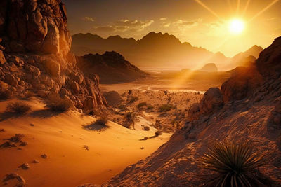 Scenic view of snowcapped mountains against sky during sunset