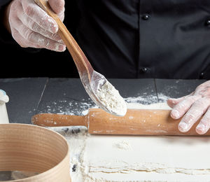 Midsection of chef preparing food