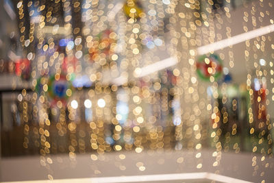 Defocused image of illuminated city at night