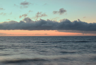Scenic view of sea against sky at sunset
