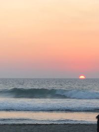 Scenic view of sea against clear sky during sunset