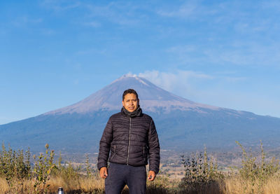 Portrait of man standing on mountain