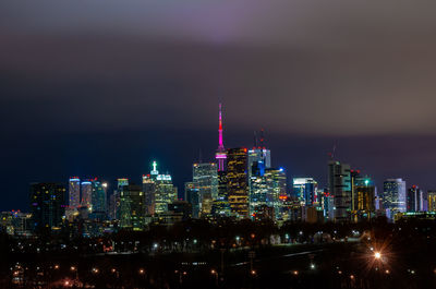 Illuminated buildings in city at night