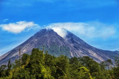 Scenic view of volcanic mountain against sky