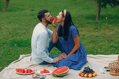 Young couple eating food