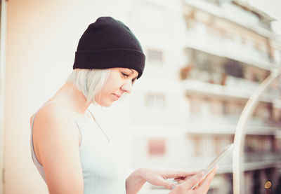 Close-up of woman using mobile phone