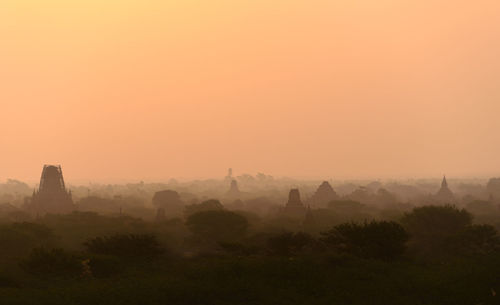 Panoramic view of temple against sky during sunset