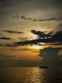 Scenic view of sea against sky at sunset