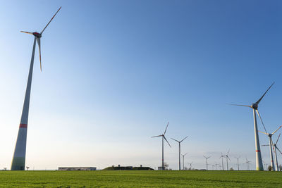 Wind turbines for the production of electricity from wind in a field in western germany.