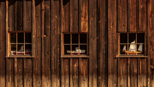 Toy boats on cottage windows