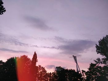 Low angle view of silhouette trees against sky at sunset