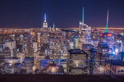 Illuminated buildings in city at night