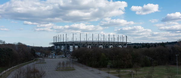 Bridge over road against sky in city