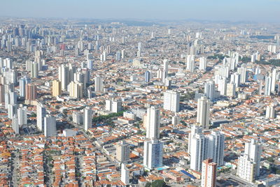 High angle view of modern buildings in city against sky