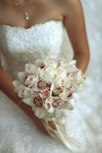 Close-up of woman holding bouquet