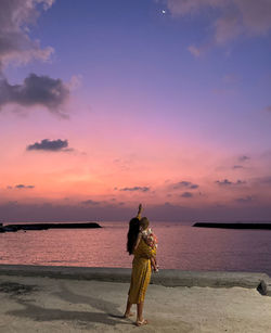 Mother showing her baby crescent at maldives
