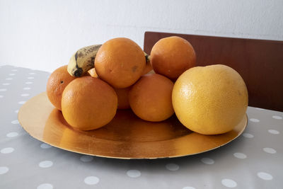 High angle view of fruits in plate on table