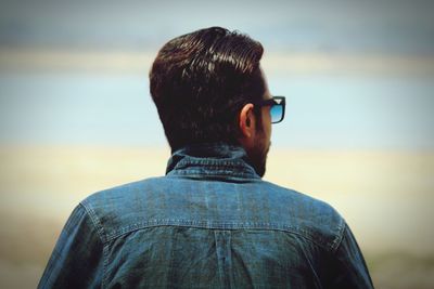 Rear view of man at beach