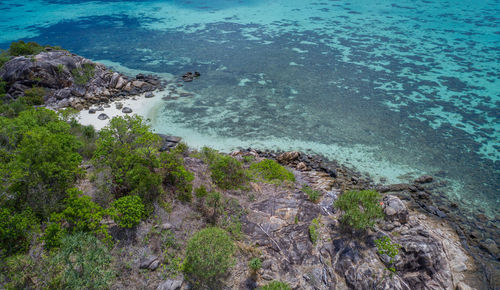 High angle view of rocks by sea