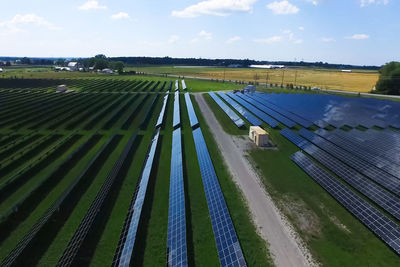 Panoramic view of agricultural field against sky