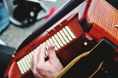 Close-up of hands playing accordion