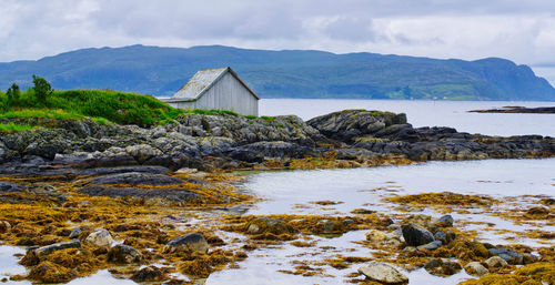 Scenic view of a small hytte next to the sea at grotlesanden in norway