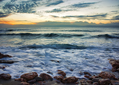 Scenic view of sea against sky during sunset