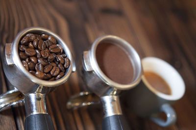 Tilt image of coffee in filter and cup on table