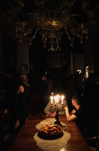 People on illuminated table