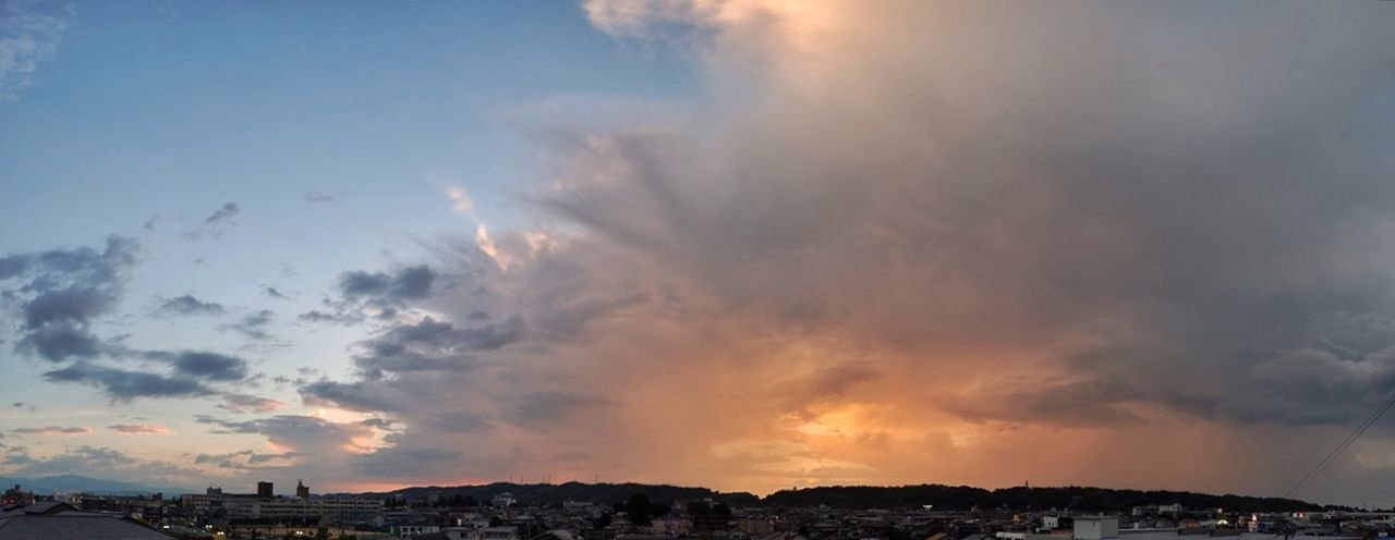 building exterior, architecture, built structure, sky, cloud - sky, sunset, city, cityscape, residential building, residential structure, cloudy, residential district, cloud, house, town, high angle view, outdoors, weather, dusk, nature