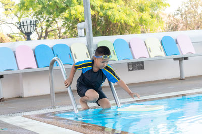 Full length of boy in swimming pool
