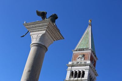 Low angle view of clock tower against sky