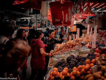 Group of people at market stall