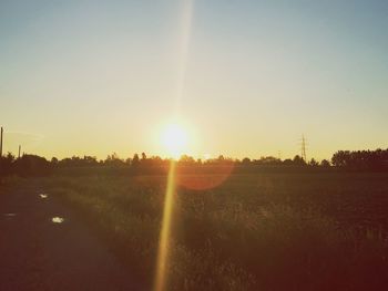 Scenic view of field against sky during sunset