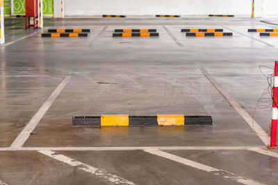 Empty block of car park with bunker to stop wheel for control distance with space