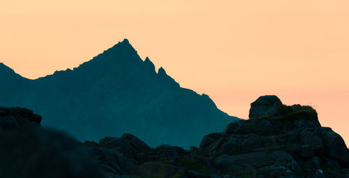 Scenic view of rock formation against sky during sunset