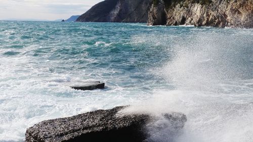 Sea waves splashing on rocks