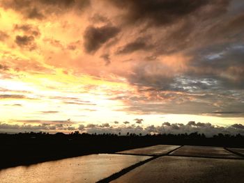 Scenic view of dramatic sky during sunset